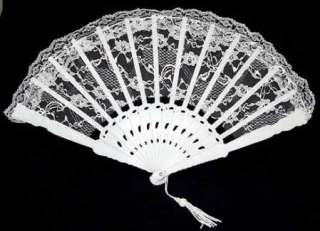 . Spanish style lace folding fan is made of white and plastic ribbing 