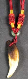 We have hung this amulet on an adjustable DARK RED (Maroon) silk 