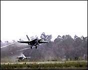 TWO F 18 HORNETS ON TAKE OFF