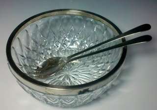 For sale is a crystal salad serving bowl with a silver trim and a pair 