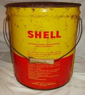 Up for grabs are these two large oil cans. The one has Shell on it 