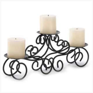   than this curvy candle stand elegantly fashioned from wrought iron