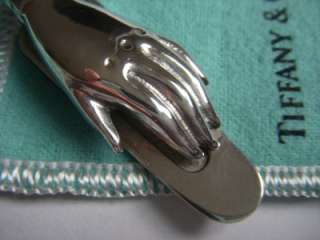   . Its a sterling silver bookmark clip in the form of a ladys hand