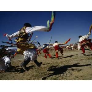  Men Dance in Traditional Tibetan Dress at a Horse Festival 